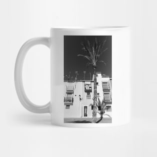 Black and image of typical Mediterranean apartments with tall palm Mug